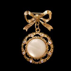 Vintage 1928 Gold Tone Bow Brooch White Stone